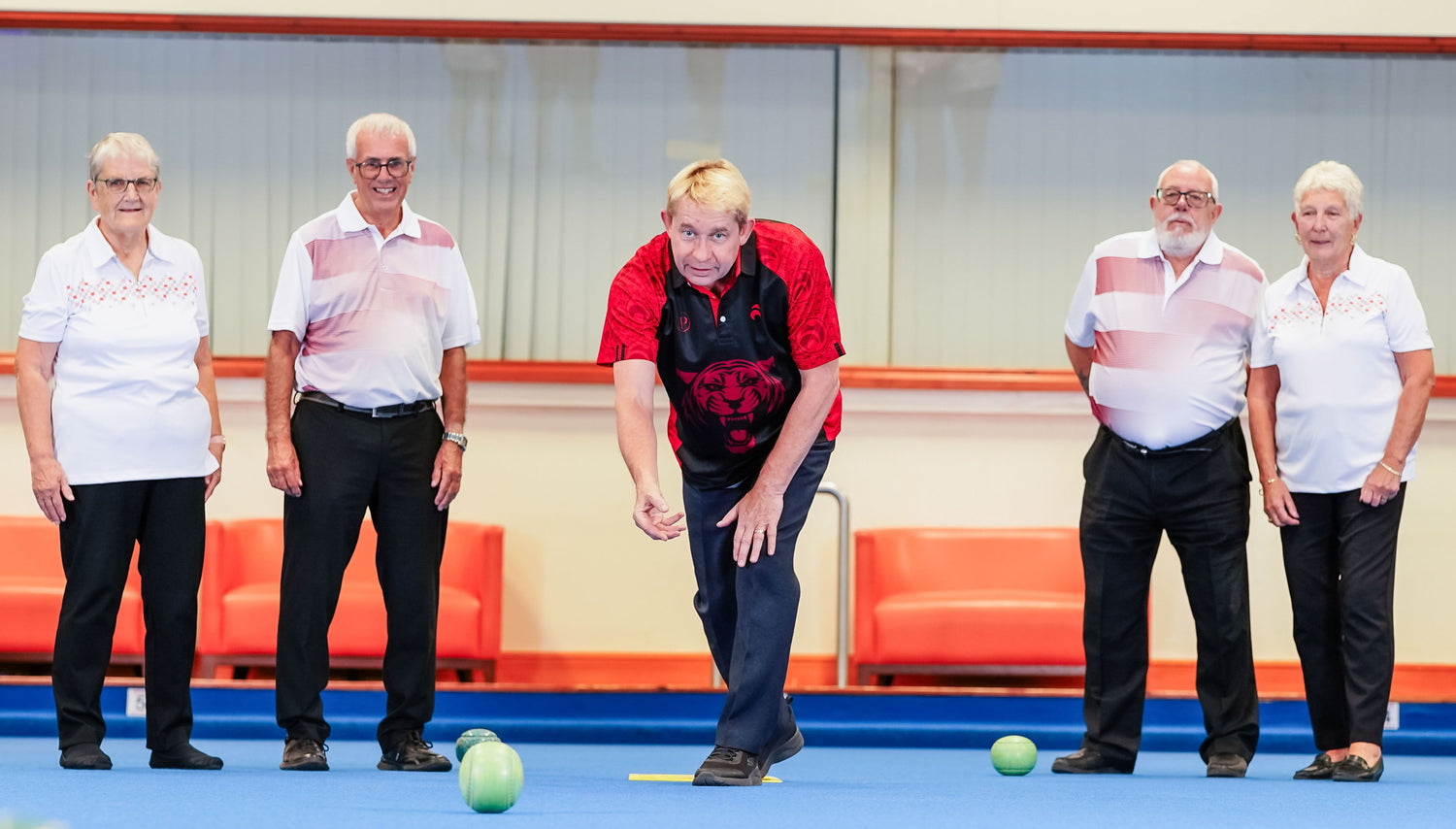 Greg coaching and bowling
